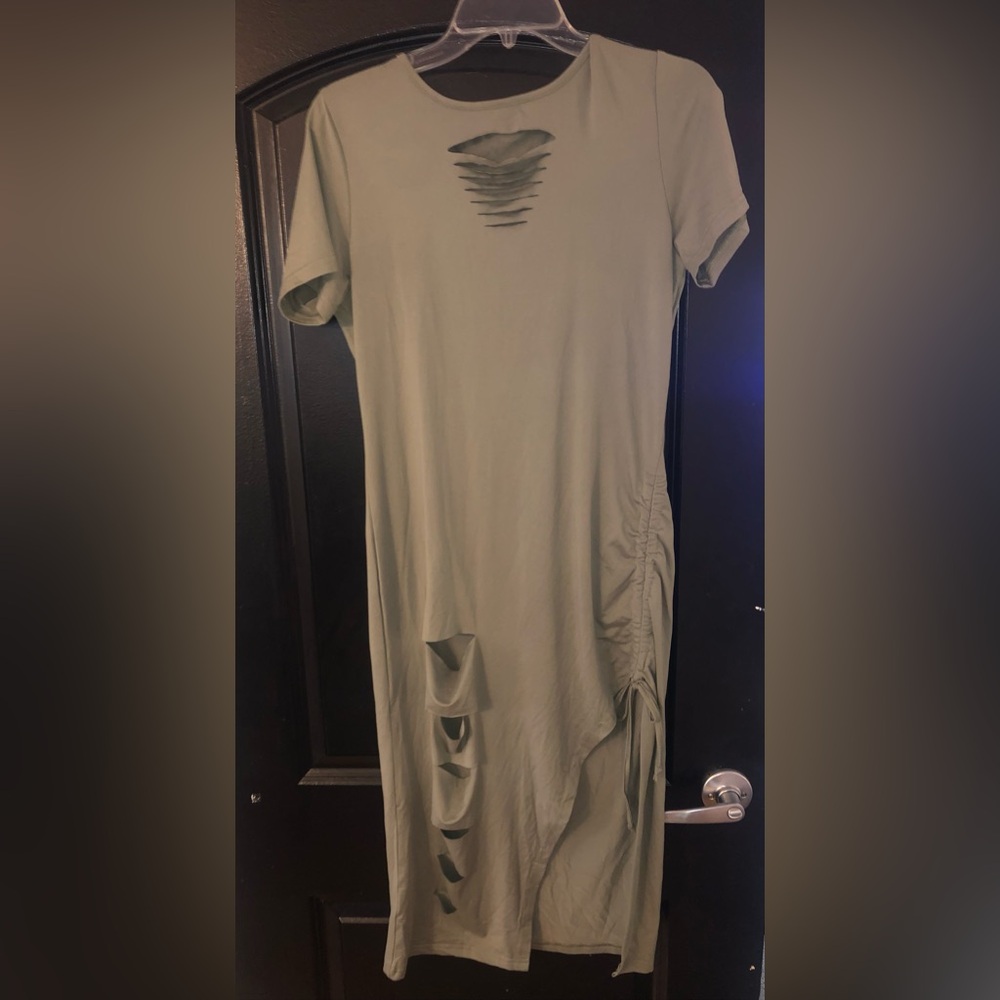 Dress with cleavage and thigh high slits.